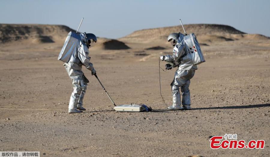 Astronauts are spending a month in isolation on a simulated \'red planet\' in the desolate Dhofar desert in Oman to help prepare humanity for a future mission to Mars. Using a drone, robotic rovers and an inflatable greenhouse, the astronauts will carry out 19 experiments on this baron area, picked for its resemblance to Mars. Seen from space, the Dhofar Desert is a flat, brown expanse and few animals or plants survive its temperatures that can top 125 degrees Fahrenheit, or 51 degrees Celsius. 
On the eastern edge of a seemingly endless dune is the Oman Mars Base is a giant 2.4-ton inflated habitat surrounded by shipping containers turned into labs and crew quarters. More than 200 scientists from 25 nations have chosen it as their location to field-test technology for a manned mission to the red planet which Nasa hopes to achieve by the 2030s. (Photo/Agencies)