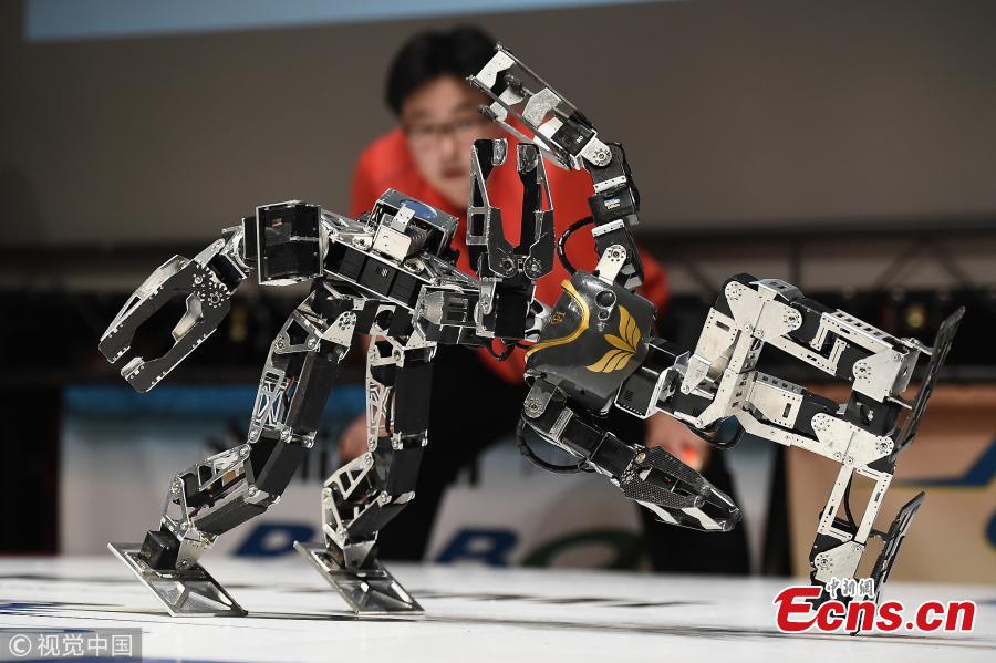 Robots fight during the 32nd ROBO-ONE tournament in Tokyo, Japan, Feb. 25, 2018. According to the organizer, the ROBO-ONE, held by the Biped Robotics Association, is a robot fighting competition for bipedal walking robots, aiming to improve the robotic technology and spread the popularity of bipedal walking robots. (Photo/Agencies)