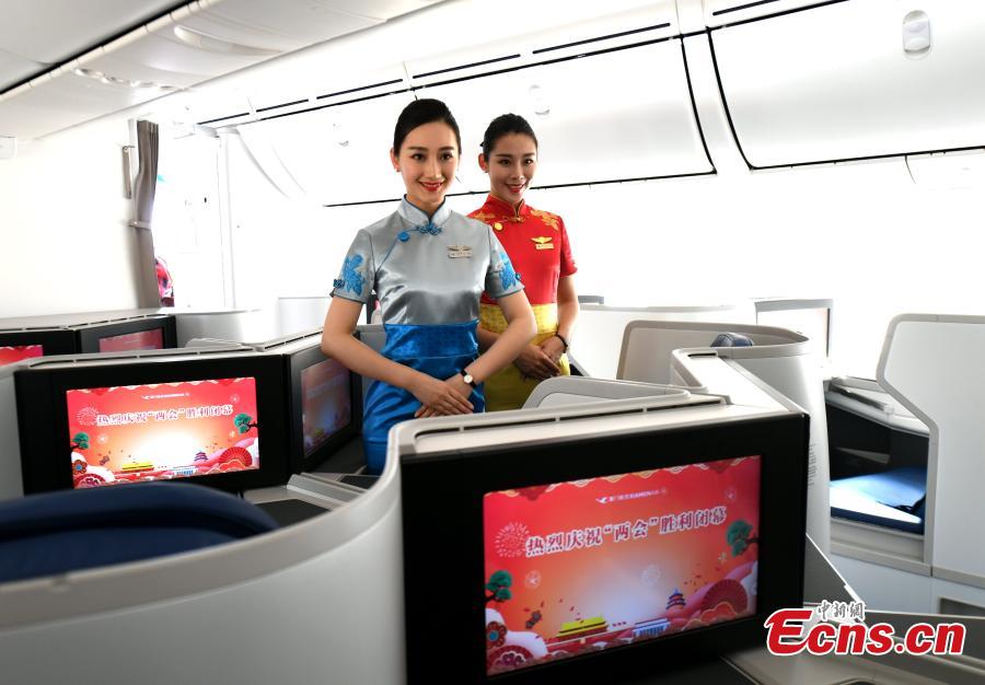 A view of the inside of a Xiamen Airlines plane, featuring the UN Sustainable Development Goals (SDGs) in its exterior decoration, in Fuzhou City, the capital of East China\'s Fujian Province, March 21, 2018. In an effort to create more awareness about the goals, the airline painted the exterior of one of its aircraft with the theme, a first for the airlines industry. The two sides signed the agreement at the UN headquarters in New York to underscore the airlines\' commitment to supporting the new development agenda on Feb. 15, 2017. (Photo: China News Service/Wang Dongming)
