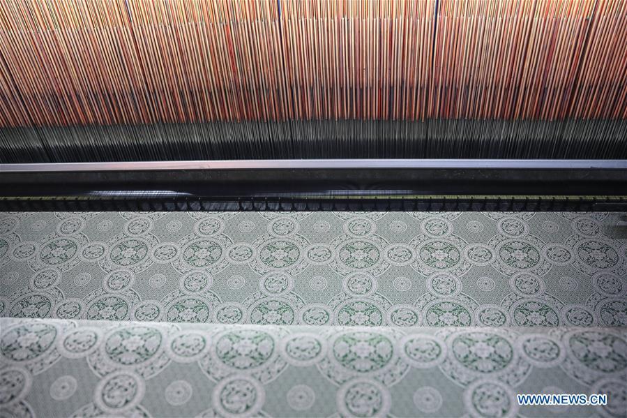 Photo taken on March 31, 2018 shows Song brocade made by a modern weaving machine at the Wujiang Dingsheng Silk Company in Shengze Town, Suzhou City of east China\'s Jiangsu Province. Song brocade, dating back to the Song Dynasty (960-1127) in ancient China, was listed as the World Intangible Cultural Heritage in 2009. Dedicated in inheriting and developing of Song brocade, the Wujiang Dingsheng Silk Company has applied the brocade to the making of products such as bags, boxes, clothing and handicrafts. (Xinhua/Yang Lei)