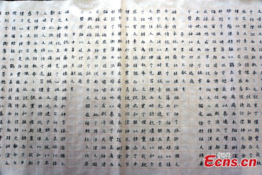 The hand-writing homework of students from the Yu Youren Calligraphy School is on display in a hall at Xianyang Normal University in Xianyang City, Northwest China\'s Shaanxi Province, April 9, 2018. Students were required to finish calligraphy writing of 20,000 Chinese characters during their one-month winter vacation. The school said it aims to foster a habit for students to write calligraphy. (Photo: China News Service/Zhang Yuan)