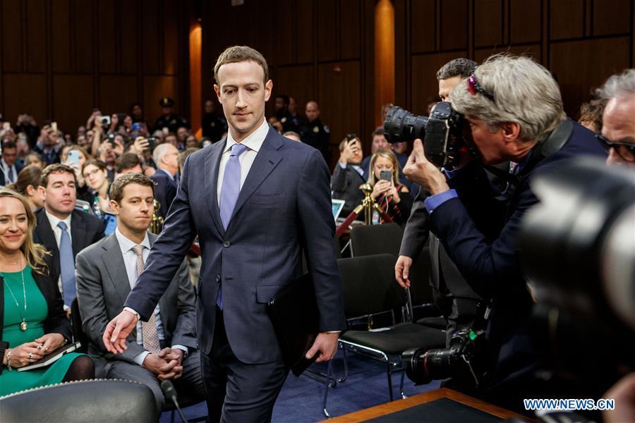 Facebook CEO Mark Zuckerberg (C, Front) arrives to testify at a joint hearing of the Senate Judiciary and Commerce committees on Capitol Hill in Washington D.C., United States, on April 10, 2018. Facebook CEO Mark Zuckerberg told Congress in written testimony on Monday that he is \