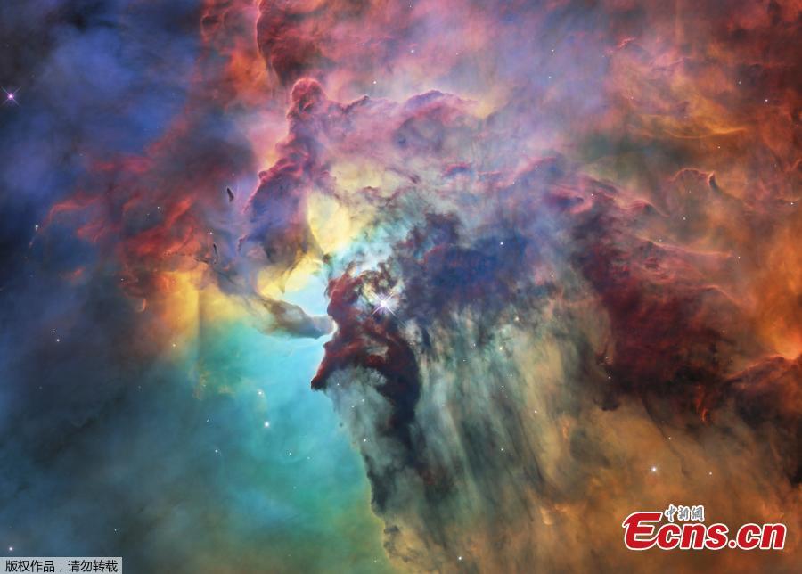 A photo released on April 19, 2018 by the European Space Agency shows this colourful image of the Lagoon Nebula to celebrate the 28th anniversary space of the the NASA/ESA Hubble Space Telescope.  The whole nebula, about 4000 light-years away, is an incredible 55 light-years wide and 20 light-years tall. This image shows only a small part of this turbulent star-formation region, about four light-years across. This stunning nebula was first catalogued in 1654 by the Italian astronomer Giovanni Battista Hodierna, who sought to record nebulous objects in the night sky so they would not be mistaken for comets. Since Hodierna\'s observations, the Lagoon Nebula has been photographed and analysed by many telescopes and astronomers all over the world. The observations were taken by Hubble\'s Wide Field Camera 3 between 12 February and 18 February 2018. (Photo/Agencies)