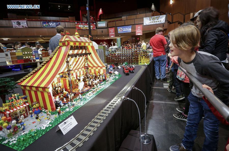 People view LEGO creations at the BrickCan LEGO convention in Vancouver, Canada, April 21, 2018. About 200 LEGO builders across the world showcased more than 6,000 pieces of creations at the annual BrickCan event which is claimed to be Canada\'s largest public LEGO fan convention. (Xinhua/Liang Sen)