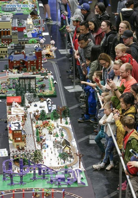 People view LEGO creations at the BrickCan LEGO convention in Vancouver, Canada, April 21, 2018. About 200 LEGO builders across the world showcased more than 6,000 pieces of creations at the annual BrickCan event which is claimed to be Canada\'s largest public LEGO fan convention. (Xinhua/Liang Sen)