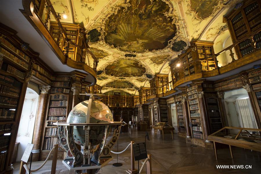 Picture taken on April 20, 2018 shows the Abbey Library in north-eastern Switzerland\'s St. Gallen city. The library is one of the richest and oldest in the world and contains 170,000 works and some 2,100 original medieval handwritten manuscripts, including the earliest-known architectural plan drawn on parchment. (Xinhua/Xu Jinquan)