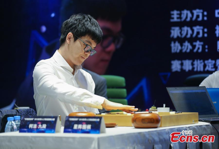 Chinese Go player Ke Jie (L) competes with artificial intelligence program \