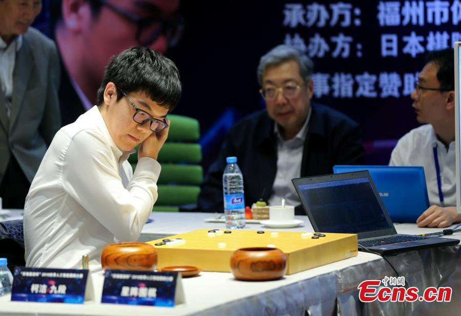 Chinese Go player Ke Jie (L) competes with artificial intelligence program \