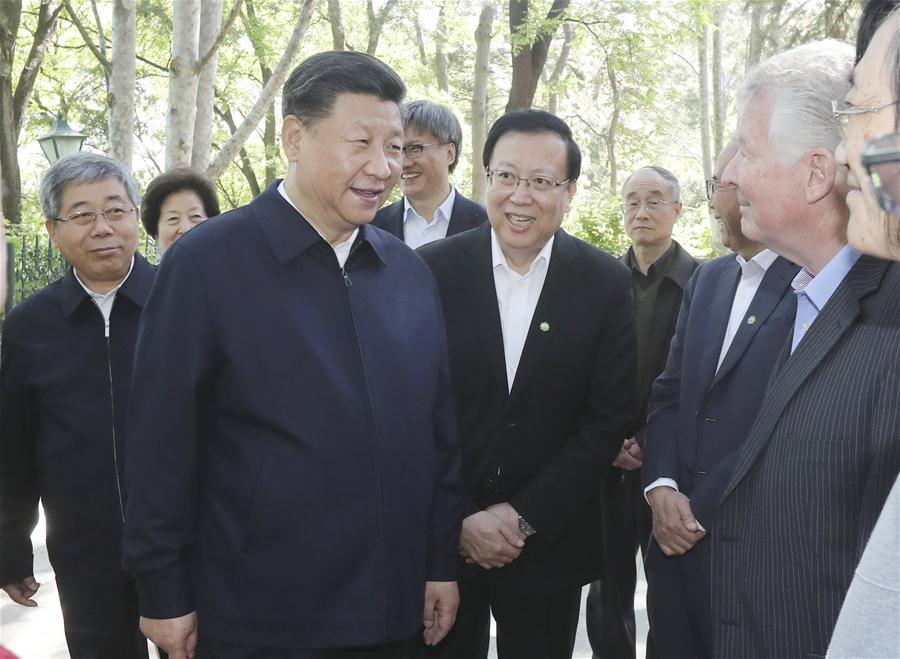 Chinese President Xi Jinping, also general secretary of the Communist Party of China Central Committee and chairman of the Central Military Commission, visits some senior professionals and representatives of young and middle-aged teachers of Peking University (PKU) at PKU campus in Beijing, capital of China, May 2, 2018. Xi made an inspection tour of PKU on Wednesday. (Xinhua/Sheng Jiapeng)