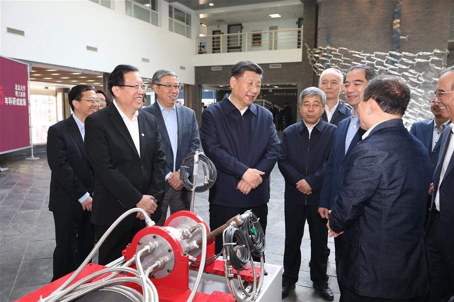 
Chinese President Xi Jinping, also general secretary of the Communist Party of China Central Committee and chairman of the Central Military Commission, is briefed about the latest development of Peking University (PKU) at PKU in Beijing, capital of China, May 2, 2018. Xi made an inspection tour of PKU on Wednesday. (Xinhua/Yao Dawei)