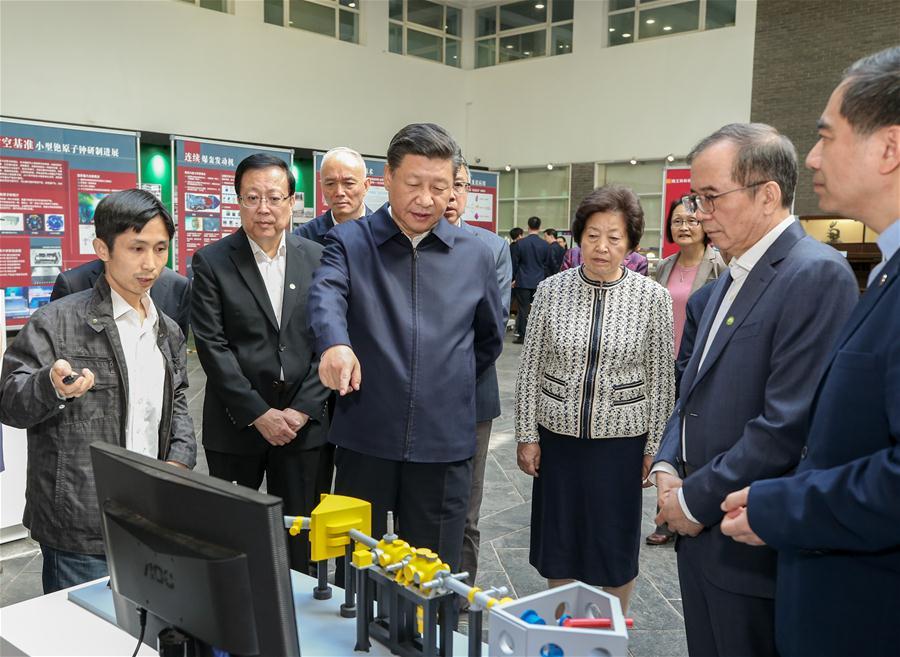 Chinese President Xi Jinping, also general secretary of the Communist Party of China Central Committee and chairman of the Central Military Commission, watches scientific research devices and physical models at Peking University (PKU) in Beijing, capital of China, May 2, 2018. Xi made an inspection tour of PKU on Wednesday. (Xinhua/Yao Dawei)