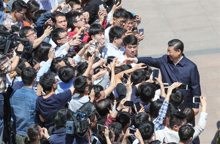 Chinese President Xi Jinping, also general secretary of the Communist Party of China Central Committee and chairman of the Central Military Commission, shakes hands with teachers and students at Peking University (PKU) in Beijing, capital of China, May 2, 2018. Xi made an inspection tour of PKU on Wednesday. (Xinhua/Wang Ye)