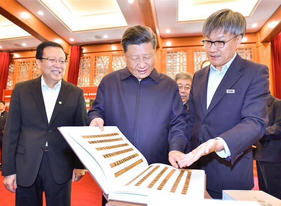 Chinese President Xi Jinping (C, front), also general secretary of the Communist Party of China Central Committee and chairman of the Central Military Commission, visits an exhibition displaying achievements of Peking University (PKU) over the past five years at PKU in Beijing, capital of China, May 2, 2018. Xi made an inspection tour of PKU on Wednesday. (Xinhua/Li Tao)
