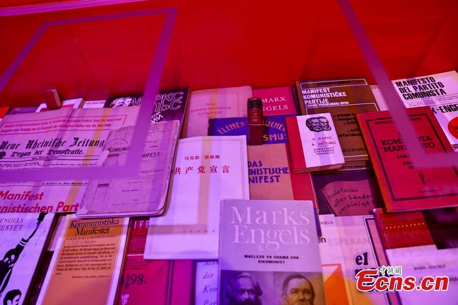 The Manifesto of the Communist Party, in different language editions, on display at the Karl Marx House museum, May 6, 2018. An exhibition is underway to honor the German philosopher as this year marks the 200th anniversary of his birth. (Photo: China News Service/Peng Dawei)