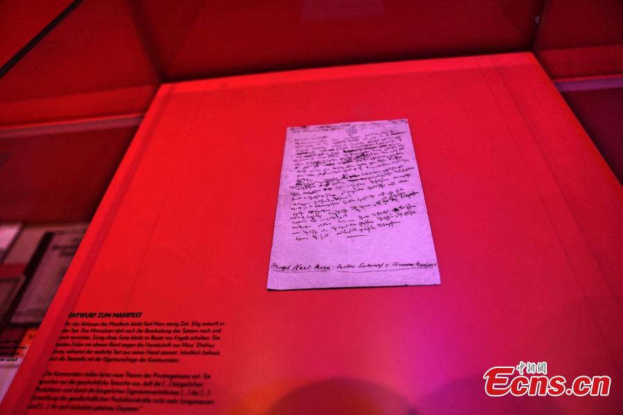Karl Marx\'s manuscript for the Manifesto of the Communist Party on display at the Karl Marx House museum, May 6, 2018. An exhibition is underway to honor the German philosopher as this year marks the 200th anniversary of his birth. (Photo: China News Service/Peng Dawei)