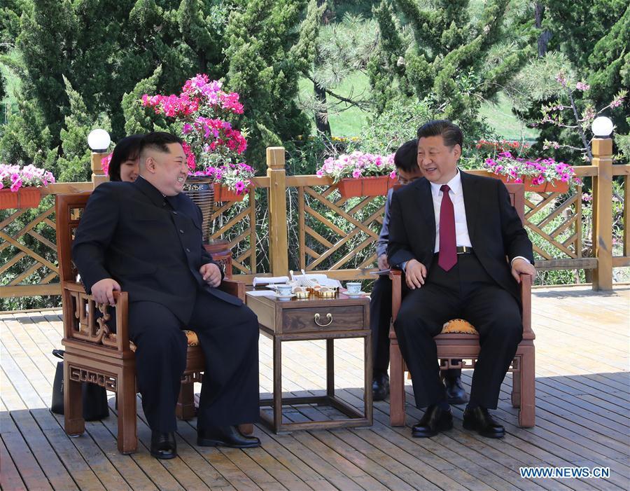 
Xi Jinping (R), general secretary of the Central Committee of the Communist Party of China (CPC) and Chinese president, holds talks with Kim Jong Un, chairman of the Workers\' Party of Korea (WPK) and chairman of the State Affairs Commission of the Democratic People\'s Republic of Korea (DPRK), in Dalian, northeast China\'s Liaoning Province, on May 7-8. (Xinhua/Ju Peng)
