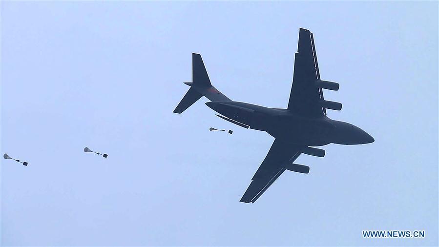 In this undated file photo, China\'s Y-20 heavy transport aircraft takes part in an airborne and air delivery training. China\'s Y-20 heavy transport aircraft has undergone its first airborne and air delivery training, said the Chinese air force on Tuesday. According to Shen Jinke, spokesperson of the air force, it marked a leap in the air force\'s strategic delivery and long-distance airborne combat abilities. (Xinhua)