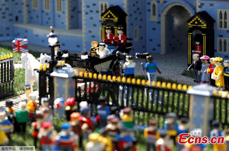 A LEGO Windsor Castle replete with the upcoming wedding between Britain\'s Prince Harry and Meghan Markle, is seen at Legoland, in Windsor, Britain May 10, 2018. LEGOLAND\'s specialist model makers built the castle using a staggering 39,960 of the toy bricks. (Photo/Agencies)