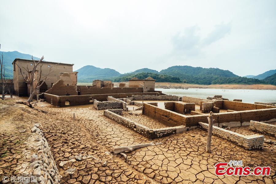 The ruins of a village emerge from the Tiantangshan reservoir after water drops in Longmen County, South China’s Guangdong Province. The village was submerged by water in 1992 while local residents were relocated. (Photo/VCG)