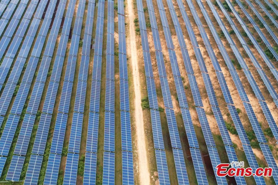 An aerial view of a photovoltaic power plant in Taihe County, East China’s Jiangxi Province, May 23, 2018. The 30MW project, with an investment of 240 million yuan ($37.6 million), was part of efforts to help eradicate poverty in the county. (Photo: China News Service/Deng Heping)