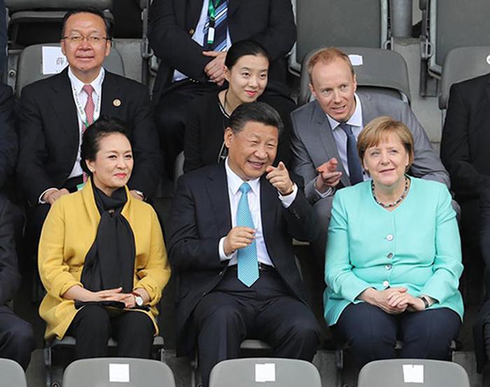 President Xi Jinping his wife Peng Liyuan and German Chancellor Angela Merkel watch a friendly soccer match between Chinese and German youth teams in Berlin, July 5, 2017. [Photo/Xinhua]


From July 4 to 8 in 2017, President Xi Jinping paid his second state visit to Germany and attended the annual summit of the Group of Twenty major economies in Hamburg, sending a strong message to the world that both sides are committed to enhancing political trust and facilitating free trade and economic globalization.