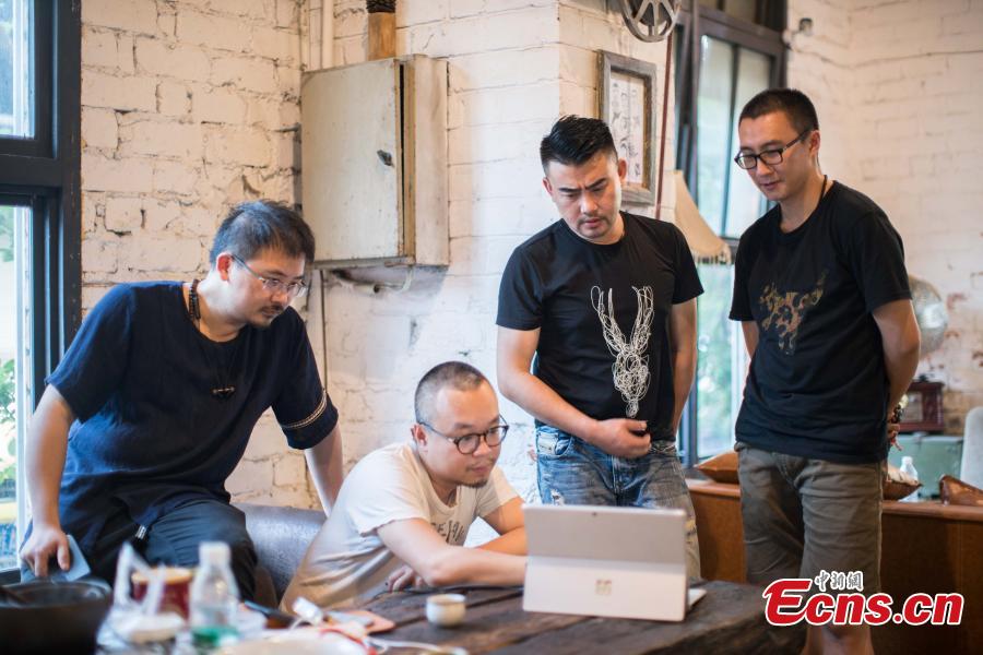 A startup located in a former factory space has won many awards for their video and music productions in Nanning City, South China’s Guangxi Zhuang Autonomous Region. Xu Xiaomao, Ouyang Dinghua and Wei Ning rented the space in April 2015 and renovated it for their startup in video and music production. The closed tractor factory was built in 1956 of the former Soviet style. (Photo: China News Service/Liu Yujun)