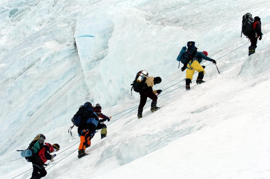 Members of China Tibet Climbing Team on their way to Mount Qomolangma on May 2005. They assisted the State Bureau of Surveying and Mapping to re-evaluate the height of Mount Qomolangma. (Photo/Xinhua)