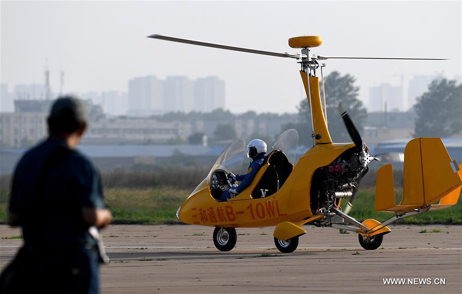 An aviation enthusiast lands after a rehearsal for the 10th Air Sports Cultural Tourism Festival in Anyang, central China\'s Henan Province, May 24, 2018. The three-day air show begins on May 25. (Xinhua/Li An)