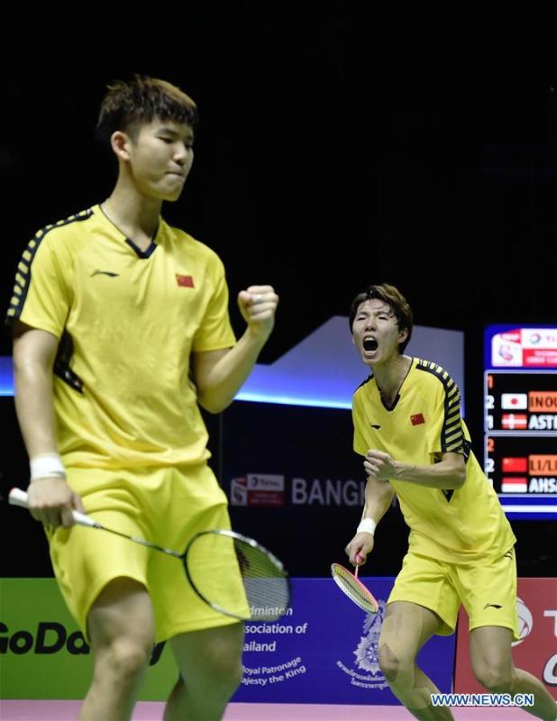 Li Junhui (R) and Liu Yuchen of team China celebrate after winning the BWF Thomas Cup 2018 semifinal against Mohammad Ahsan and Hendra Setiawan of team Indonesia in Bangkok, Thailand, on May 25, 2018. Team China advanced to the final with 3-1.(Xinhua/Wang Shen)