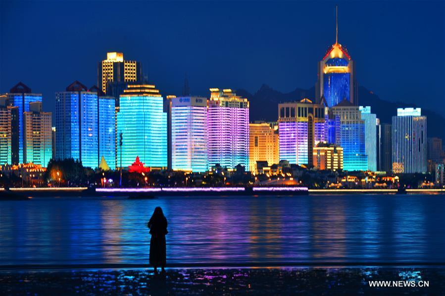 Photo taken on May 26, 2018 shows a night view of the Qianhai area in Qingdao, a coastal city in east China\'s Shandong Province which will host a summit of the Shanghai Cooperation Organization next month. (Xinhua/Wang Haibin)