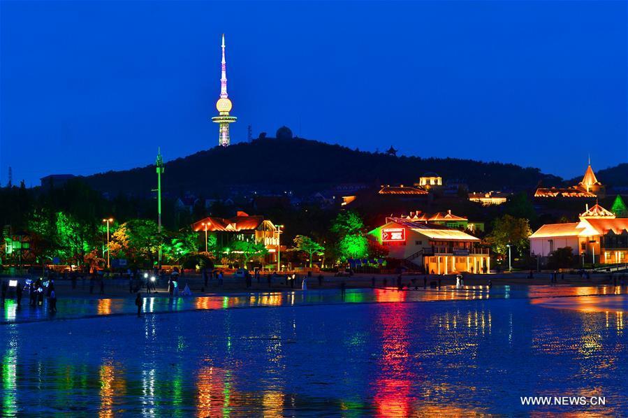 Photo taken on May 26, 2018 shows a night view of the Qianhai area in Qingdao, a coastal city in east China\'s Shandong Province which will host a summit of the Shanghai Cooperation Organization next month. (Xinhua/Wang Haibin)