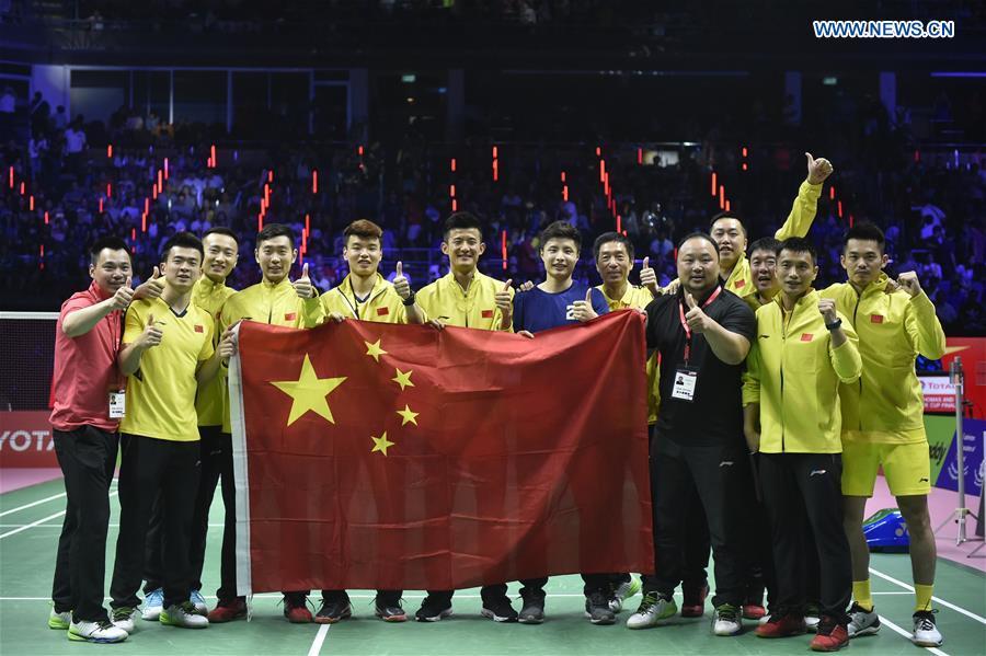 Team China celebrate after winning the final against team Japan at the Thomas Cup badminton tournament in Bangkok, Thailand, on May 27, 2018. Team China won the final 3-1 and claimed the title of the event. (Xinhua/Wang Shen)