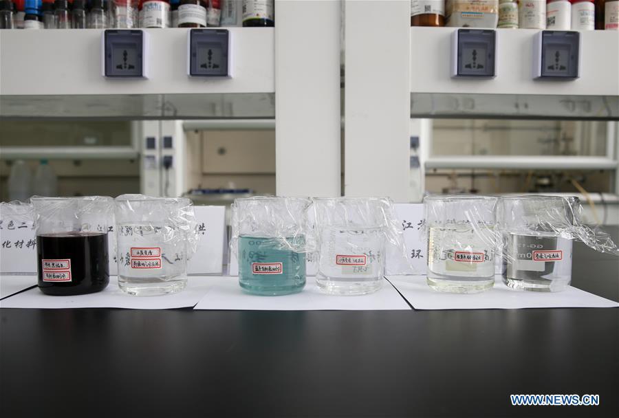 Photo taken on April 24, 2018 shows different types of contaminated water being cleaned with the composite material at the Shanghai Institute of Ceramics of Chinese Academy of Sciences in east China\'s Shanghai. A new composite material developed by a group of Chinese researchers has proved highly effective in cleaning water contaminated by organics. (Xinhua/Ding Ting)