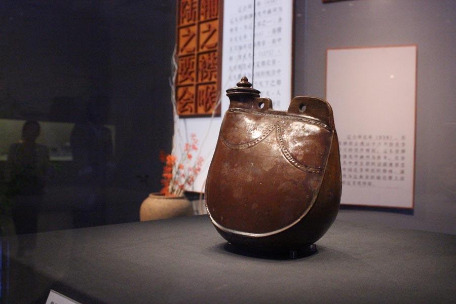 The exhibition of 169 displays at the Capital Museum in Beijing includes such items as a Qing Dynasty (1644-1911) map of the Grand Canal, and other cultural relics like daily items, pottery and construction materials. (Photo provided to China Daily)

In 1329, as much as 3.5 million dan (a container that could hold about 75 kilograms) of rice was transported via the canal from southern China to Beijing.

In 2014, a section of canal in Tongzhou was put on the UNESCO World Heritage List.

Gao says that Tongzhou was a crucial link both during the Ming (1368-1644) and Qing (1644-1911) dynasties. And this is highlighted by some of the items on display like a plate used to weigh rice at Tongzhou\'s port.

There is a list of codes on display that shows there was a complicated system to check food quality and prevent fraud.

The Tongzhou District Museum also contributed some exhibits.

Zheng Xusheng, head of the museum, talks about a Qing map of the Grand Canal, from Beijing to Shandong province, from the reign of Yongzheng (1722-35).

According to Zheng, the map was taken to Japan during the War of Resistance Against Japanese Aggression (1931-45) but was brought back to China around 2000.

\