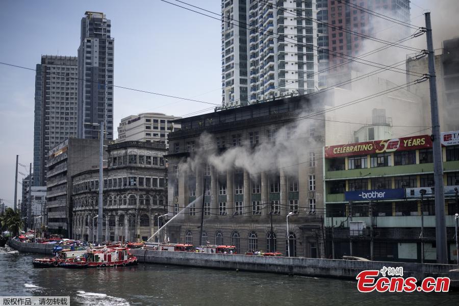 Firemen extinguish a fire at the administrative offices of the National Archives of the Philippines in Manila on May 28, 2018. (Photo/Agencies)