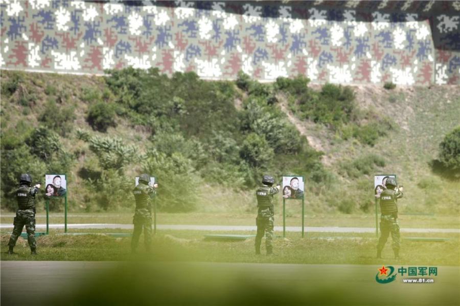 Photo taken on May 28, 2018 at the Great Wall 2018 Anti-terror International Forum shows Special Police of China members demonstrating anti-terror training programs at the Special Police Academy of the Chinese People\'s Armed Police Force in Beijing. The training included shooting and forced airplane cabin entry. (Photo/81.cn)