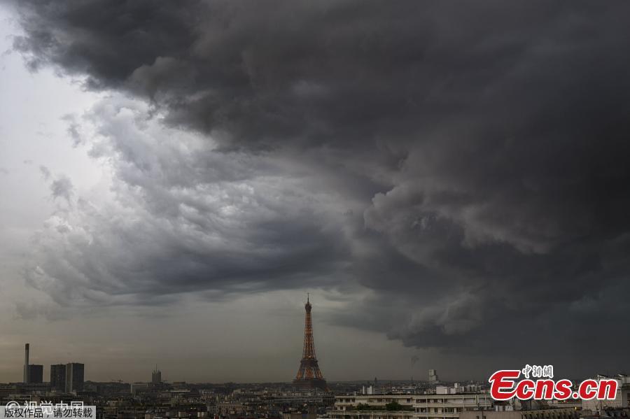 The Eiffel Tower is pictured as heavy rain hits Paris, France, May 28, 2019. (Photo/VCG)