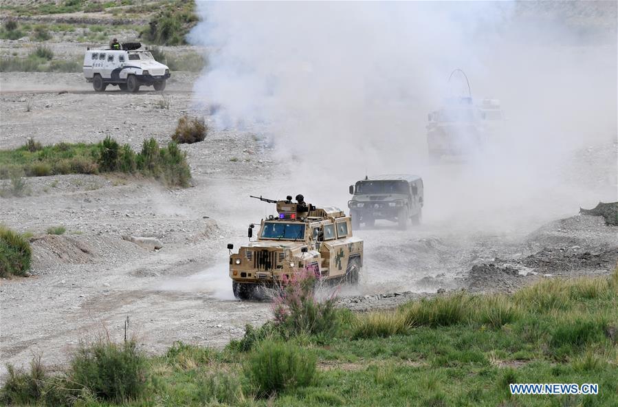Armored vehicles move during a joint anti-terrorist exercise held by China and Kyrgyzstan frontier forces in Kizilsu Kirgiz Prefecture, northwest China\'s Xinjiang Uygur Autonomous Region, June 27, 2017. The 18th Shanghai Cooperation Organization (SCO) Summit is scheduled for June 9 to 10 in Qingdao, a coastal city in east China\'s Shandong Province. Since China took over the rotating presidency of the SCO last June, more than 160 activities including a series of important institutional meetings and multilateral events have been held so far. (Xinhua/Wang Fei)