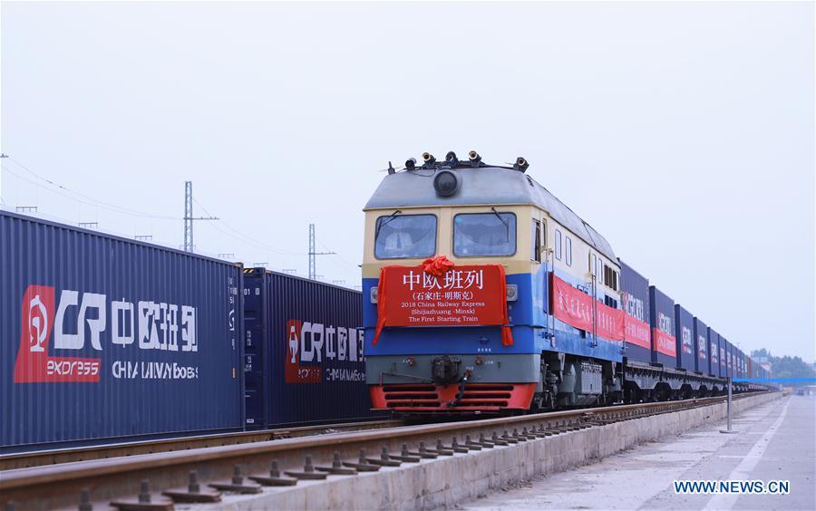Photo taken on June 2, 2018 shows a China Railway (CR) Express cargo train leaving for Minsk from Shijiazhuang, north China\'s Hebei Province. The first China-Europe CR Express cargo train from Shijiazhuang to Minsk left on Saturday. (Xinhua/Liu Peiran)