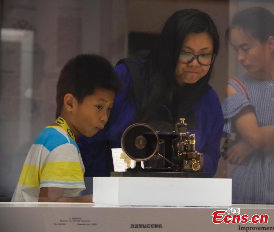 Visitors view items in the Spirit of Invention: Nineteenth-Century U.S. Patent Models from the Hagley Museum and Library exhibition at the National Museum of China in Beijing, June 3, 2018. The exhibition presented 60 of Hagley’s 19th-century patent models. (Photo: China News Service/Jia Tianyong)
