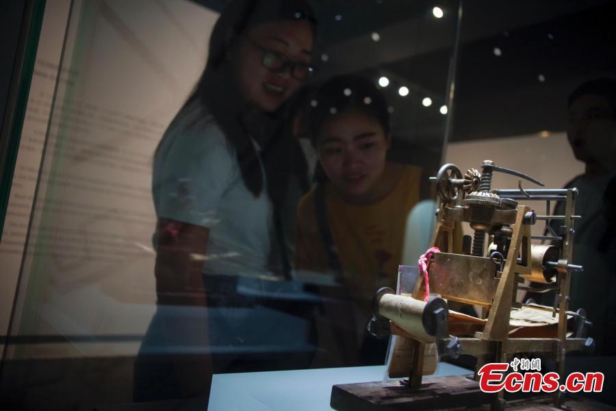 Visitors view items in the Spirit of Invention: Nineteenth-Century U.S. Patent Models from the Hagley Museum and Library exhibition at the National Museum of China in Beijing, June 3, 2018. The exhibition presented 60 of Hagley’s 19th-century patent models. (Photo: China News Service/Jia Tianyong)