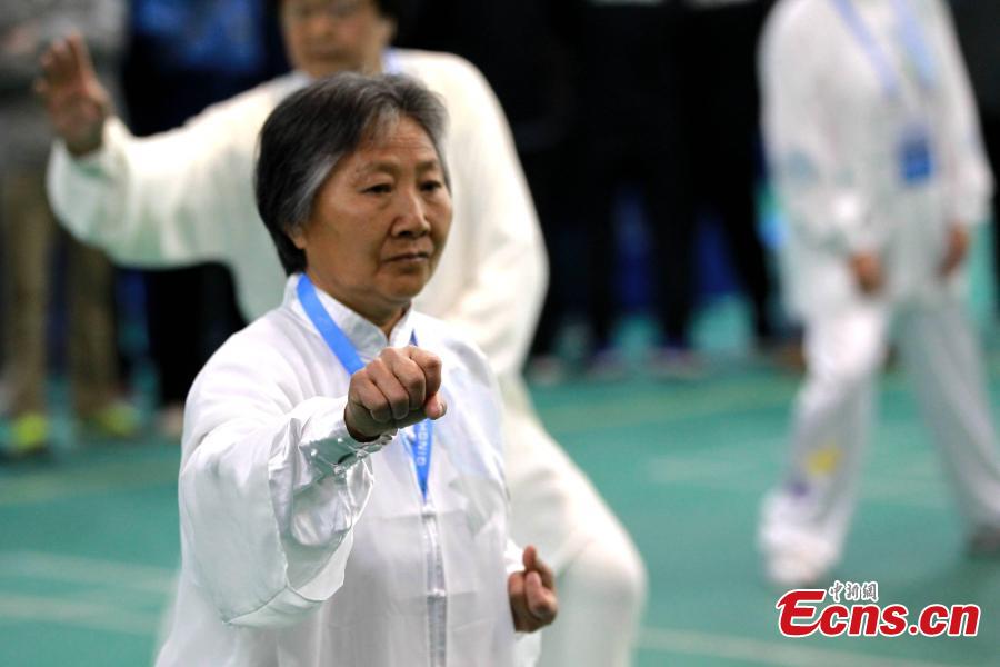 A participant performs Tai Chi in a martial arts contest during the 17th Qinghai Province Games in Xining City, Northwest China’s Qinghai Province, June 3, 2018. (Photo: China News Service/Chen Tianfu)