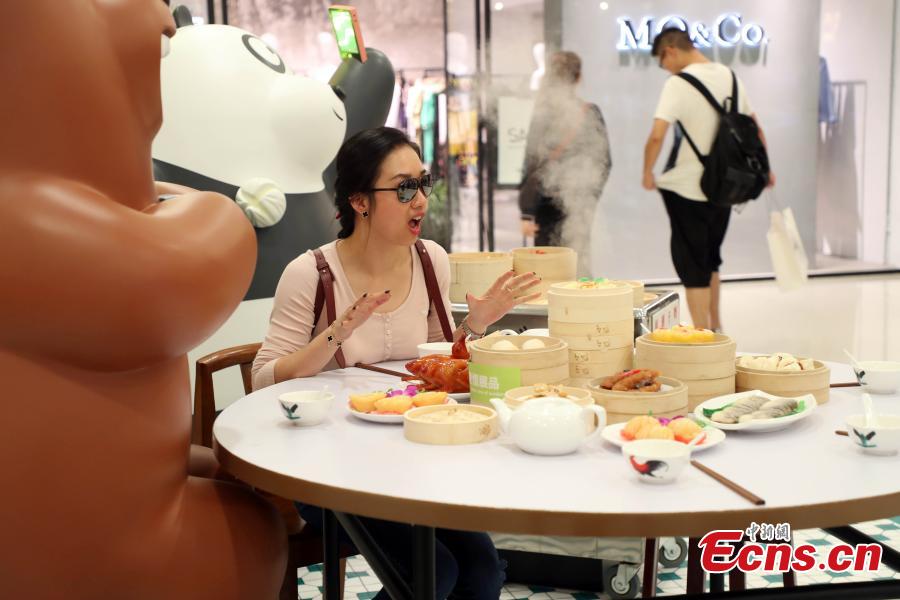 Grizzly, Panda and Ice Bear from Cartoon Network’s We Bare Bears are having their first working holiday at LCX, Ocean Terminal in Hong Kong. Visitors can snap a selfie with them as they visit a famous local teahouse, herbal tea kiosk, traditional grocery store and egg waffles stall. Their visit runs until June 17. (Photo: China News Service/Hong Shaokui)