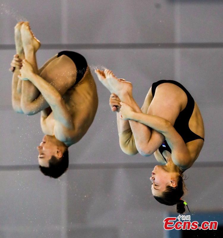 German divers compete in the mixed 10-meter synchronized platform at the FINA Diving World Cup in Wuhan City, Central China’s Hubei Province, June 4, 2018. (Photo: China News Service/Zhang Chang)