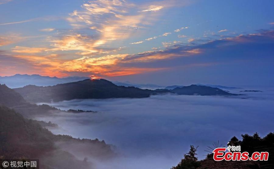 A sea of clouds after rain as the sun rises in the Qiyun Mountains in Huangshan City, East China’s Anhui Province, June 7, 2018. (Photo/VCG)