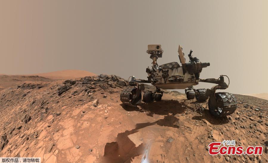 This low-angle self-portrait of NASA\'s Curiosity Mars rover shows the vehicle at the site from which it reached down to drill into a rock target called \