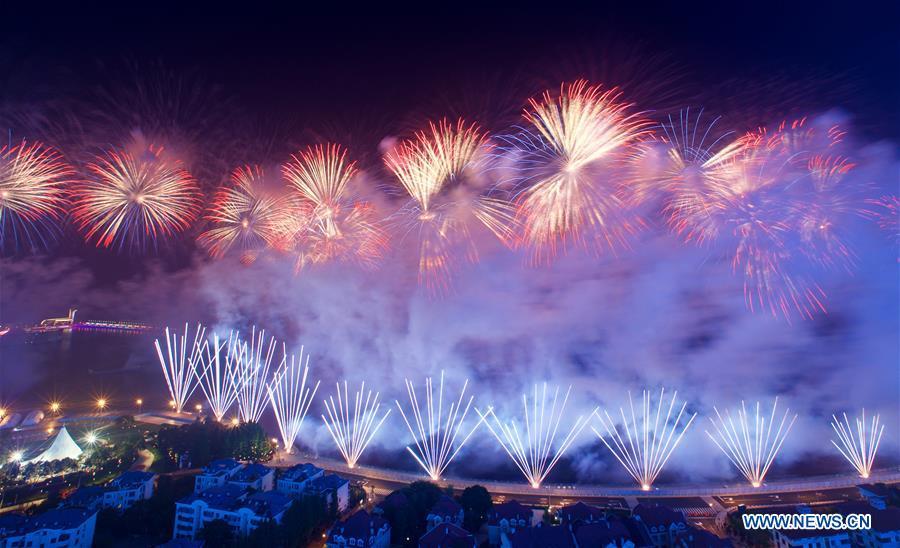 A lights and fireworks show takes place in Qingdao, the host city of the 18th Shanghai Cooperation Organization (SCO) summit, in east China\'s Shandong Province, June 9, 2018. (Xinhua/Jiang Kehong)