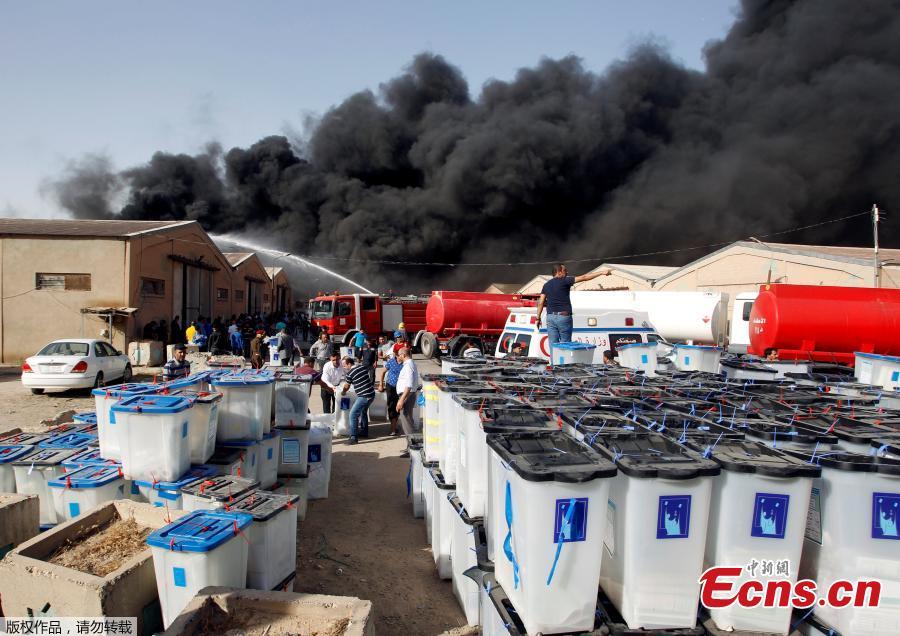 Smoke rises from a storage site in Baghdad, housing ballot boxes from Iraq\'s May parliamentary election, Iraq June 10, 2018. (Photo/Agencies)