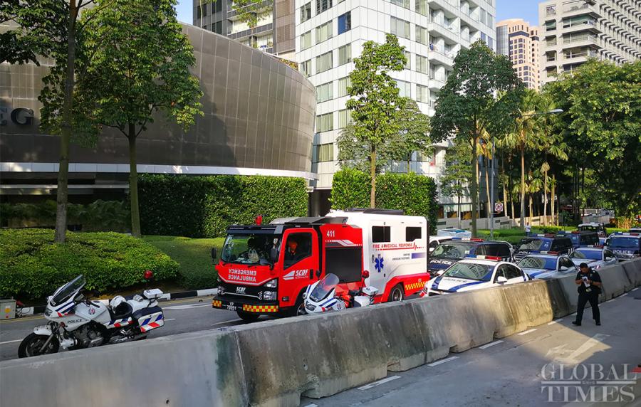 Police and emergency vehicles sit outside the St. Regis Hotel on Sunday where DPRK leader Kim Jong-un is staying. (Photo: Yang Sheng/GT)
DPRK leader Kim Jong-un arrived in Singapore on Sunday for the upcoming summit with U.S. President Donald Trump. These photographs show the preparations ahead of the summit scheduled on June 12 at the Capella Hotel on Sentosa Island, Singapore.