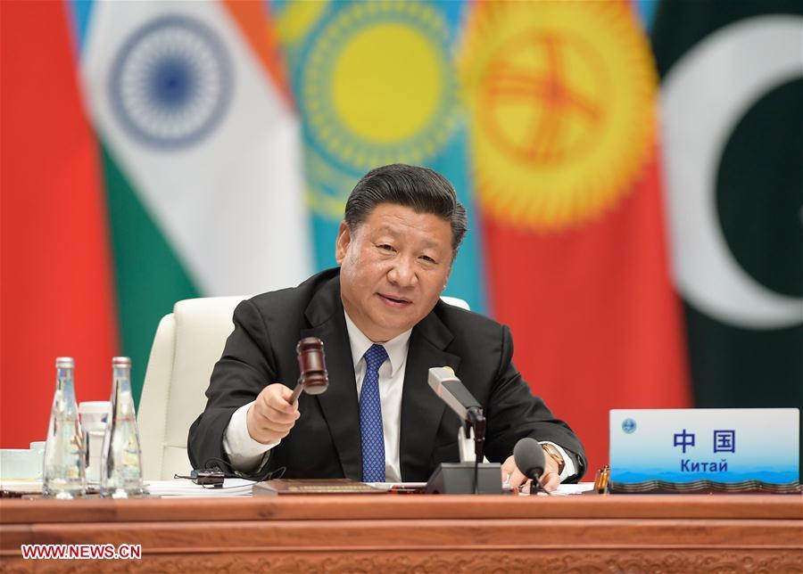 Chinese President Xi Jinping chairs the 18th Meeting of the Council of Heads of Member States of the Shanghai Cooperation Organization (SCO) in Qingdao, east China\'s Shandong Province, June 10, 2018. Xi delivered a speech during the meeting. (Xinhua/Li Xueren)